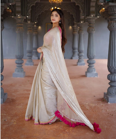 Classy Gold and Pink Saree with Glossy Finish and Tassel Accents
