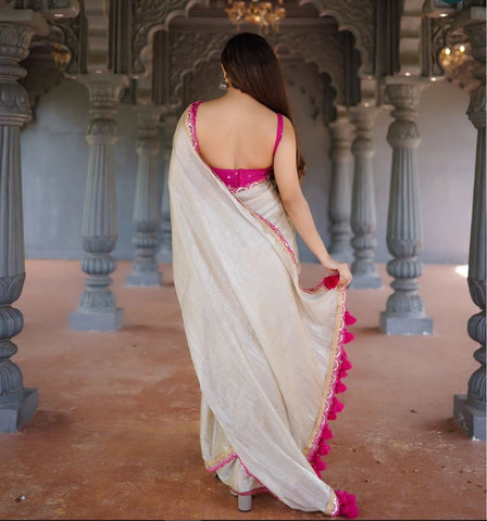 Classy Gold and Pink Saree with Glossy Finish and Tassel Accents