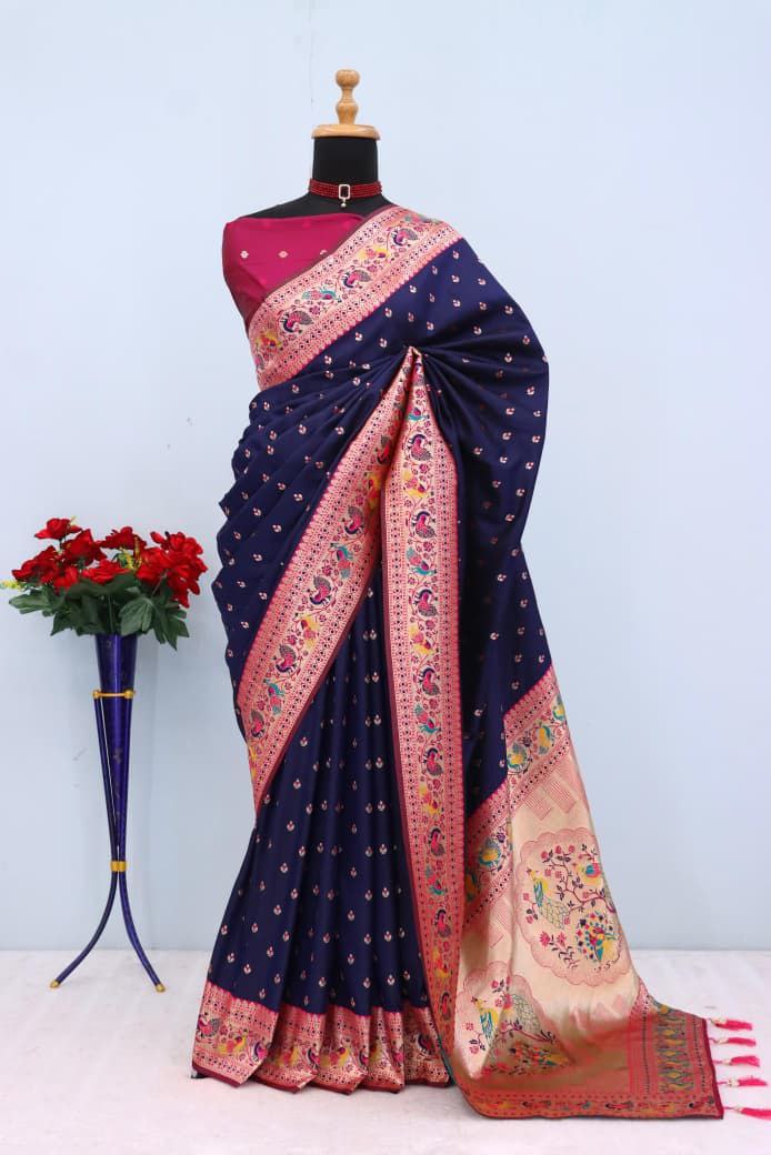 Has floral and peacock motifs on the zari border and pallu  NAVY  BLUE
