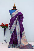 Has floral and peacock motifs on the zari border and pallu PURPLE